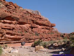 Brad helps Lori adjust her pack.